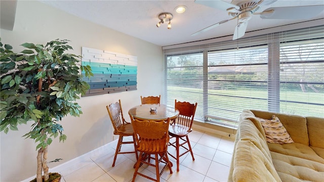 dining area featuring light tile patterned floors and ceiling fan