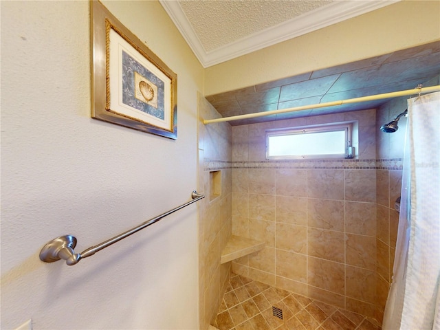 bathroom featuring curtained shower, crown molding, and a textured ceiling