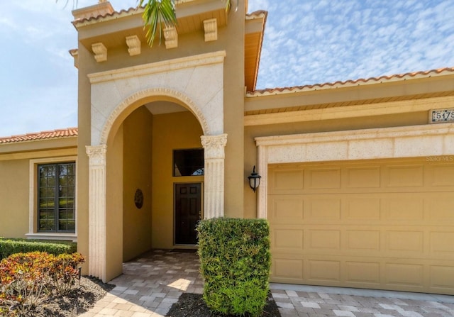 property entrance with a garage