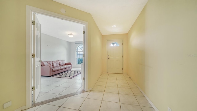 hall featuring light tile floors