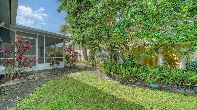 view of yard with a sunroom