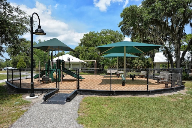 view of playground with a lawn