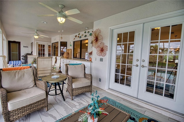 interior space with ceiling fan and french doors