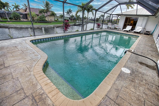 view of swimming pool with a lanai and a patio