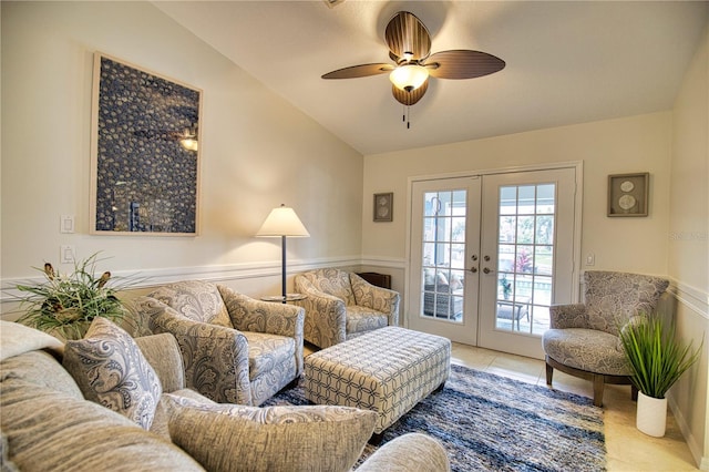 living room featuring lofted ceiling, light tile floors, ceiling fan, and french doors