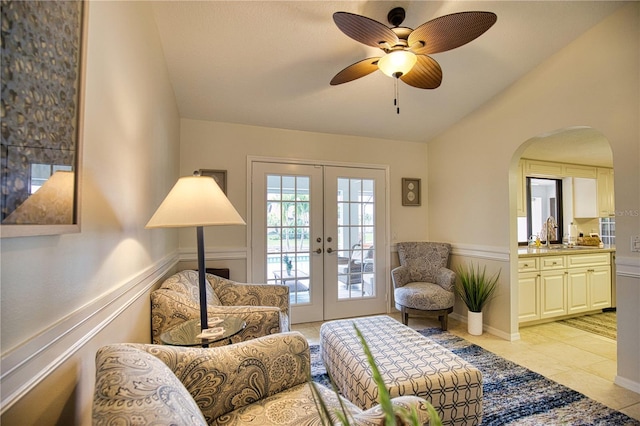 sitting room with french doors, ceiling fan, and light tile floors