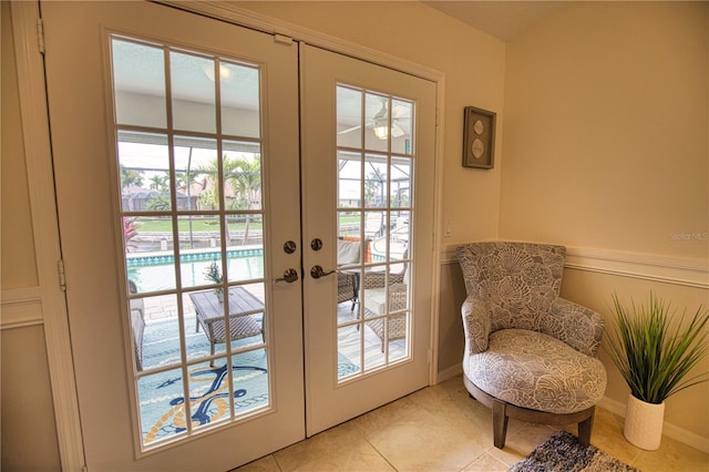 doorway with french doors and light tile patterned flooring