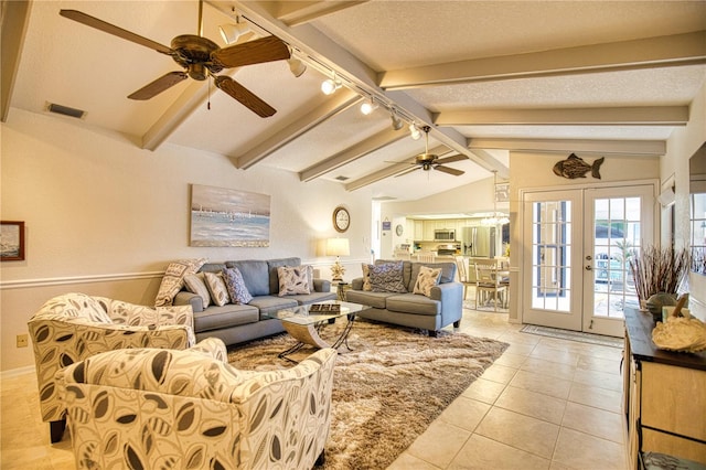 tiled living room featuring vaulted ceiling with beams, a textured ceiling, ceiling fan, track lighting, and french doors