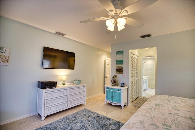 tiled bedroom with ceiling fan and connected bathroom