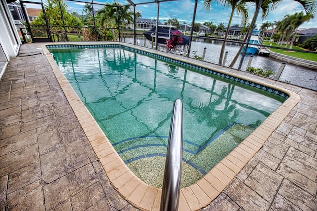 view of pool with a water view and a boat dock