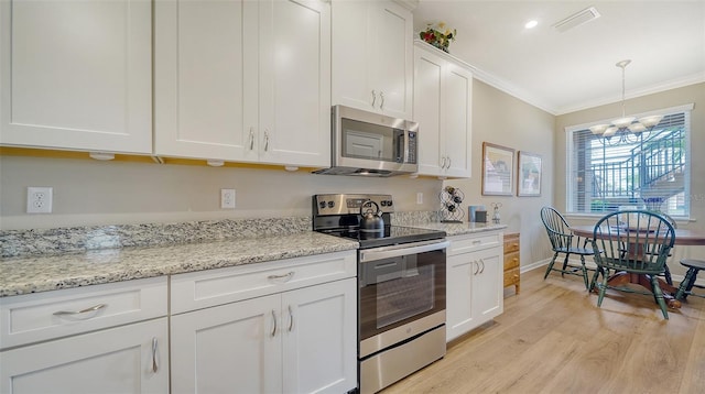 kitchen featuring stainless steel appliances, a notable chandelier, light stone countertops, light hardwood / wood-style flooring, and white cabinets