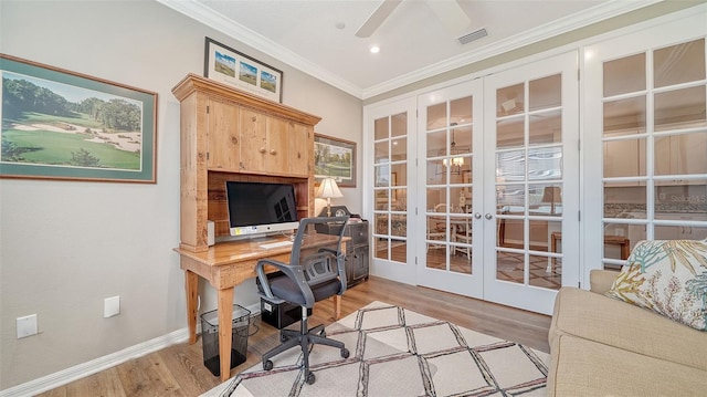 office space with french doors, crown molding, ceiling fan, and light wood-type flooring