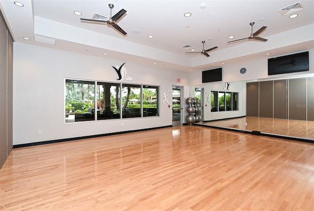 interior space featuring light hardwood / wood-style floors, ceiling fan, and a wealth of natural light