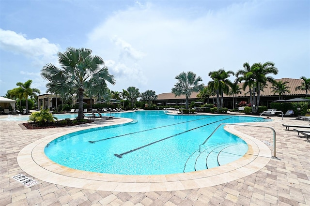 view of swimming pool with a patio area