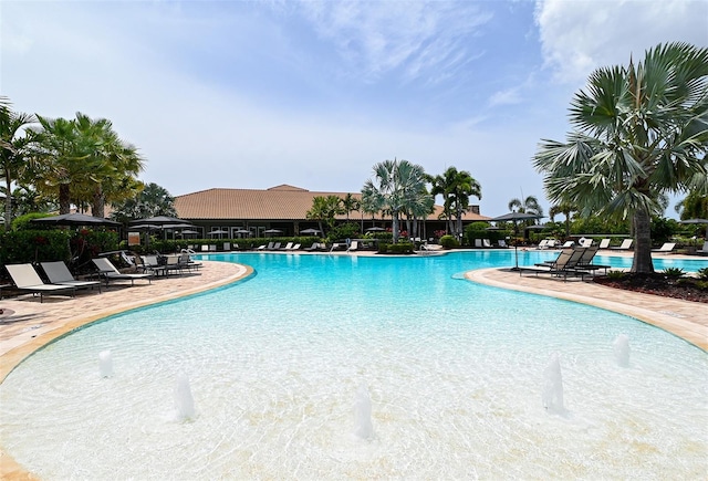 view of pool with pool water feature and a patio area