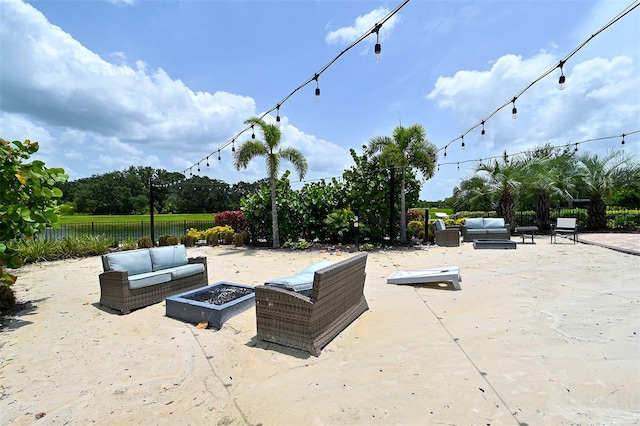 view of patio / terrace with an outdoor living space with a fire pit