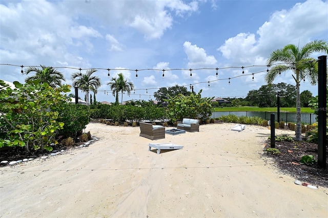 exterior space featuring a water view and a patio