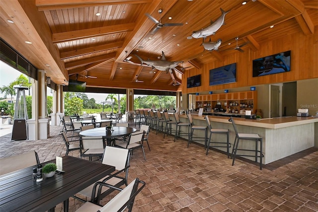 view of patio / terrace with a bar and ceiling fan