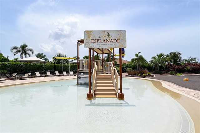 view of play area featuring a community pool