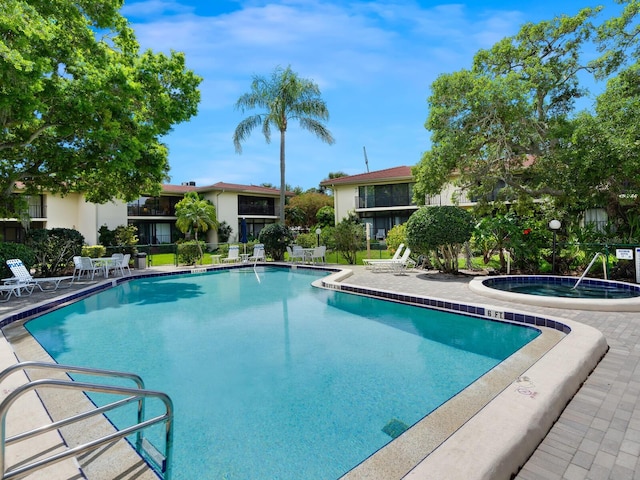 view of pool featuring a community hot tub