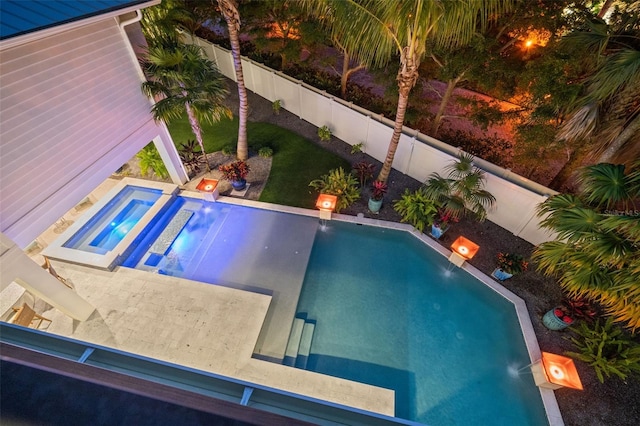 view of swimming pool featuring an in ground hot tub