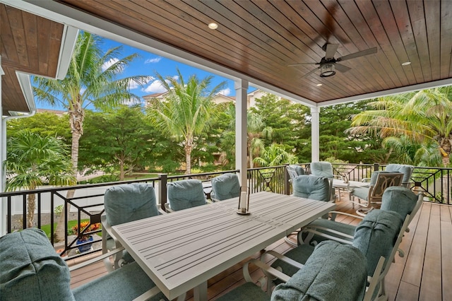 wooden deck featuring ceiling fan