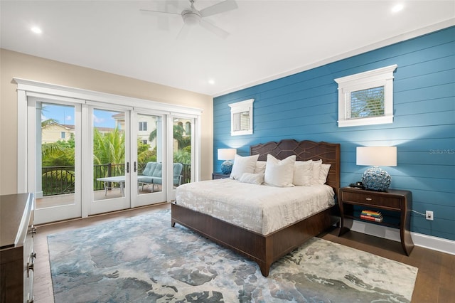 bedroom with ceiling fan, access to outside, and wood-type flooring