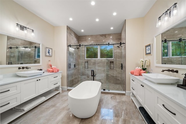 bathroom featuring vanity and plus walk in shower