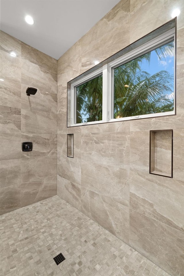 bathroom with a tile shower