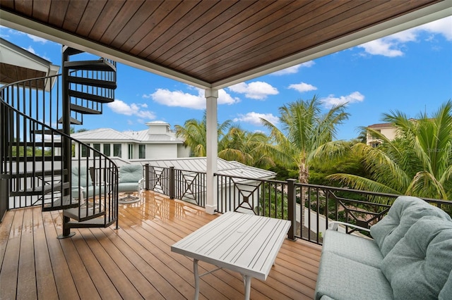 wooden terrace featuring outdoor lounge area