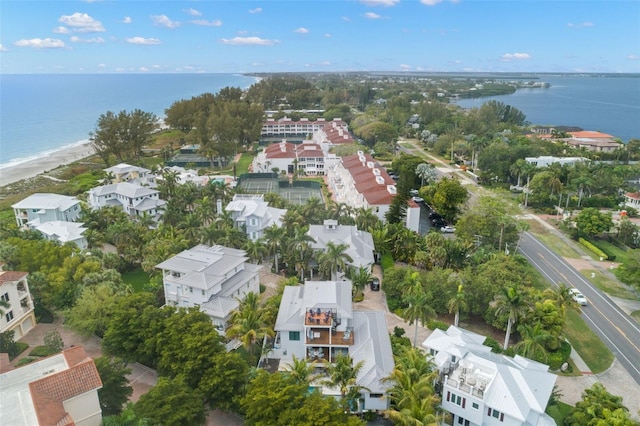 aerial view featuring a water view and a beach view