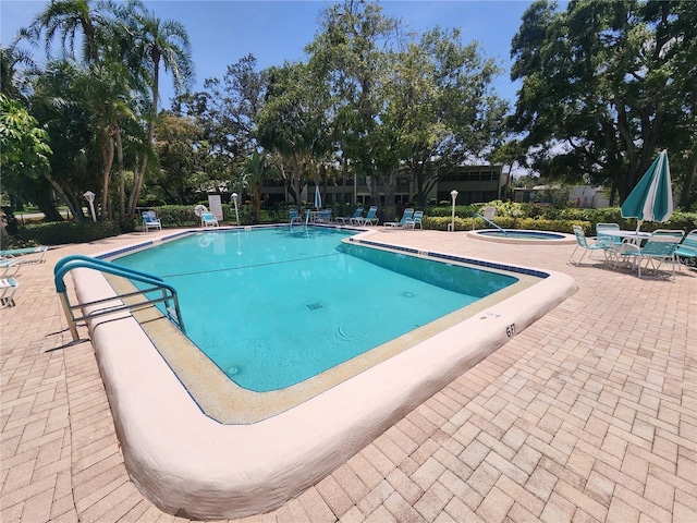 view of pool featuring a patio area