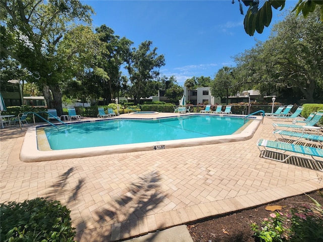 view of pool featuring a patio