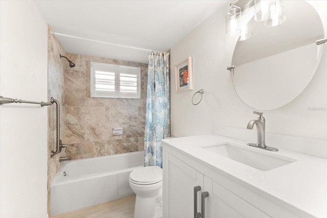 full bathroom featuring vanity, toilet, and shower / bath combination with curtain