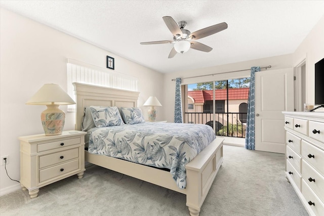 bedroom with light carpet, access to exterior, and ceiling fan