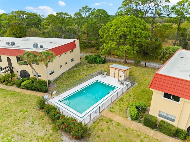 view of swimming pool featuring a yard and a patio area