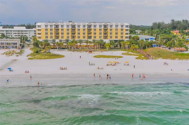 exterior space featuring a beach view and a water view