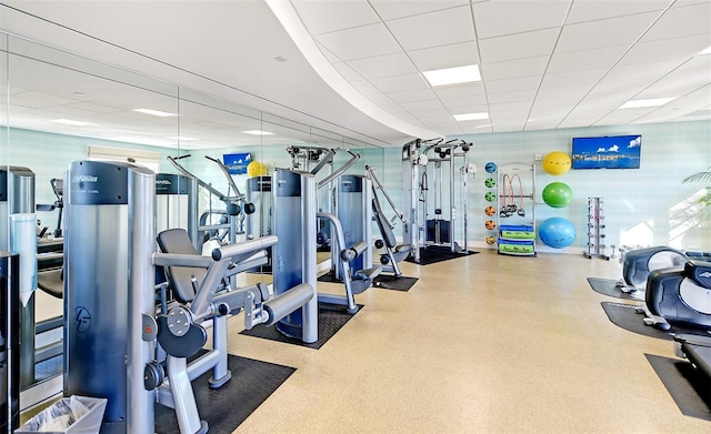 workout area with a paneled ceiling