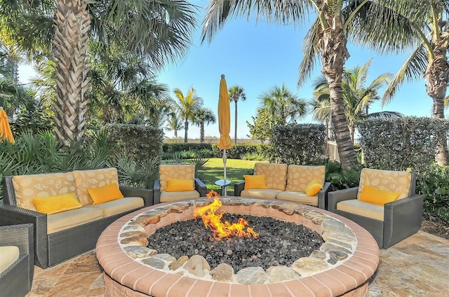 view of terrace featuring an outdoor fire pit