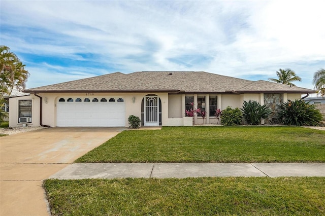 ranch-style home with a front yard and a garage