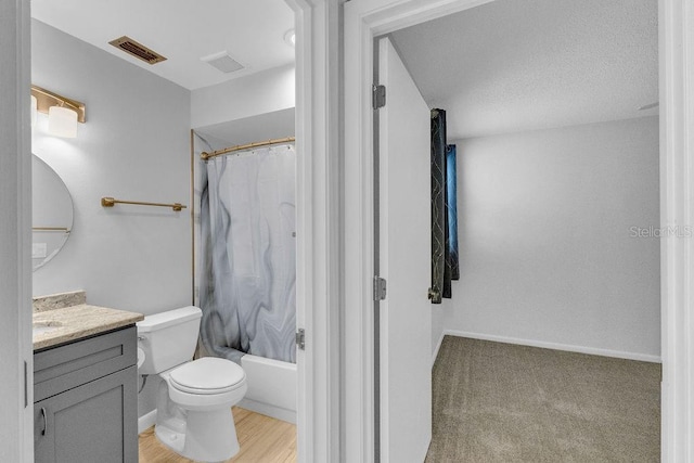 full bathroom with vanity, toilet, and shower / bath combo with shower curtain