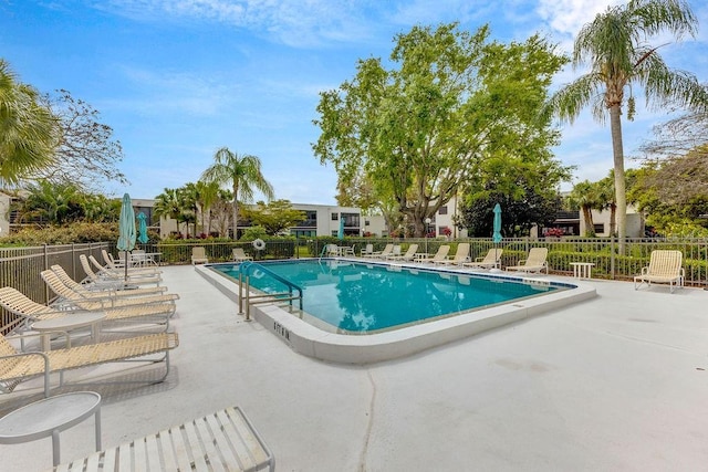 view of swimming pool featuring a patio area