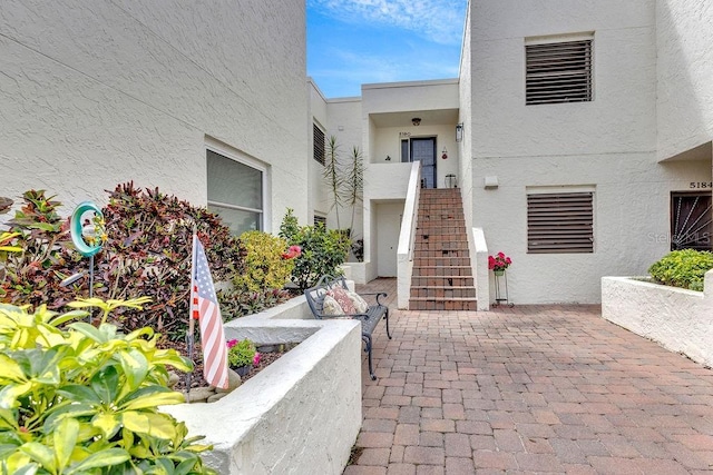 property entrance featuring a patio