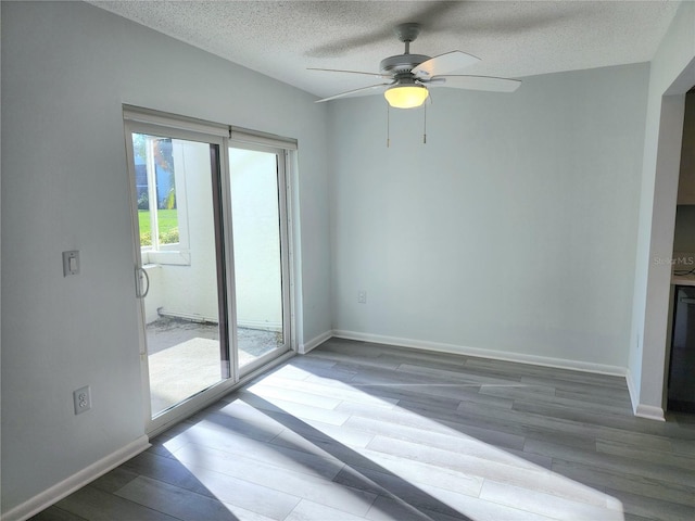 spare room with ceiling fan and a textured ceiling