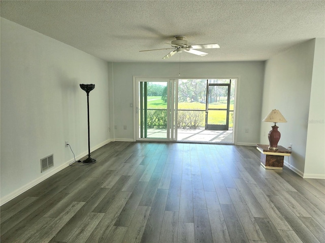 unfurnished living room with ceiling fan, wood-type flooring, and a textured ceiling