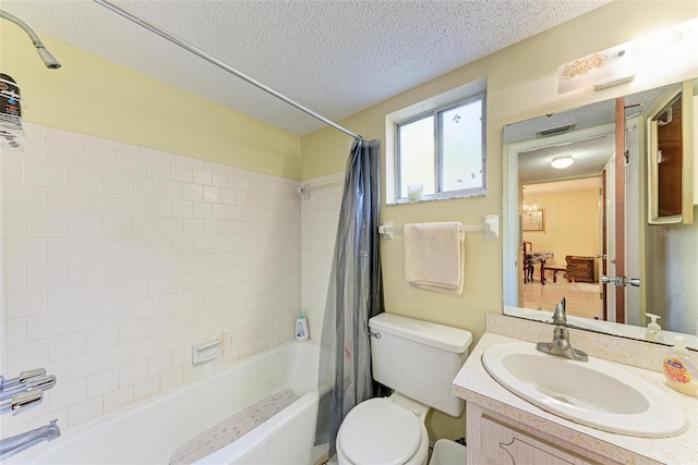 full bathroom featuring vanity, shower / tub combo with curtain, a textured ceiling, a chandelier, and toilet