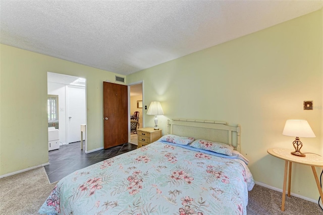 bedroom with baseboards, visible vents, tile patterned floors, a textured ceiling, and carpet flooring