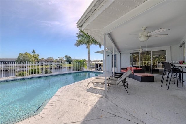 view of swimming pool featuring outdoor lounge area, a patio area, and ceiling fan