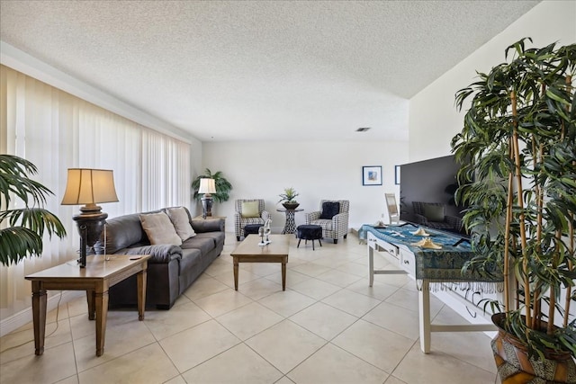 living room featuring light tile floors and a textured ceiling