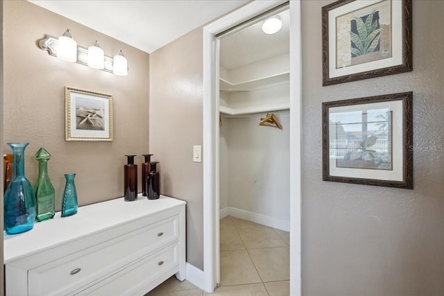 bathroom featuring tile floors and vanity